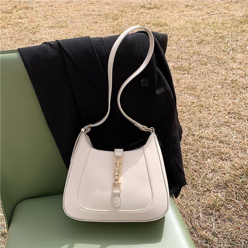 Elara's Elegant Shoulder Bag - A Unique Bag that Combines Timeless Vintage Charm and Practical Functionality. Made from Soft Vegan Leather with a Spacious Main Compartment for all your Daily Essentials.